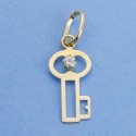 Colgante oro 18 ktes. forma llave 15 X 9 mm con circ.