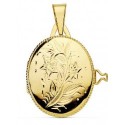 Portafotos oro 18 ktes. oval labrado 22x19